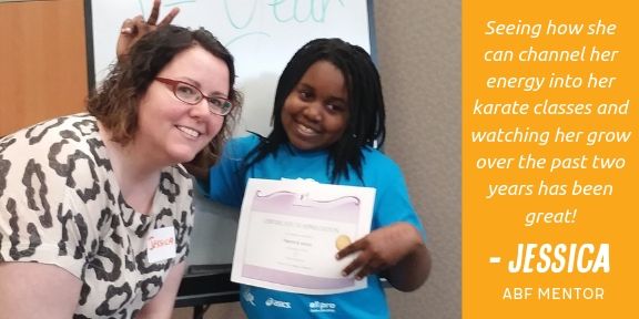 Photo of mentor Jessica posing with grantee. Text reads "seeing how she can channel her energy into her karate classes and watching her grow over the past two years has been great!- Jessica, ABF Mentor